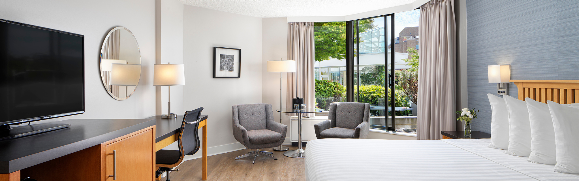 Laurel Wing King Guestroom at Inn at Laurel Point, looking out to private gardens with a ping pong table
