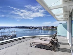 Erickson Wing Terrace Bedroom Suite Balcony with 2 lounge chairs