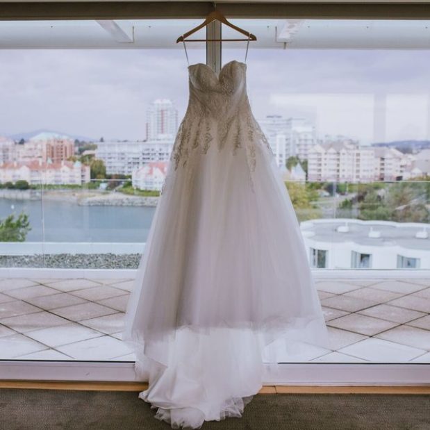 Wedding dress hanging in bridal suite