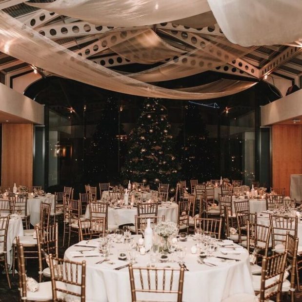 Indoor wedding reception with Christmas tree