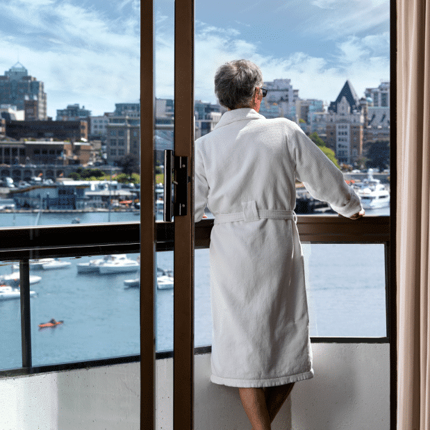 Laurel Wing Guestroom balcony with man in robe looking out