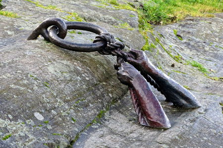 sculpture of hands tying a rope to a mooring ring, photo credit: Penny Pitcher