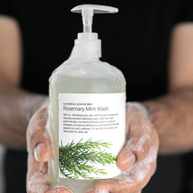 Foamy soap bottle held in hands at Saltspring Soapworks, a Key to the City Partner