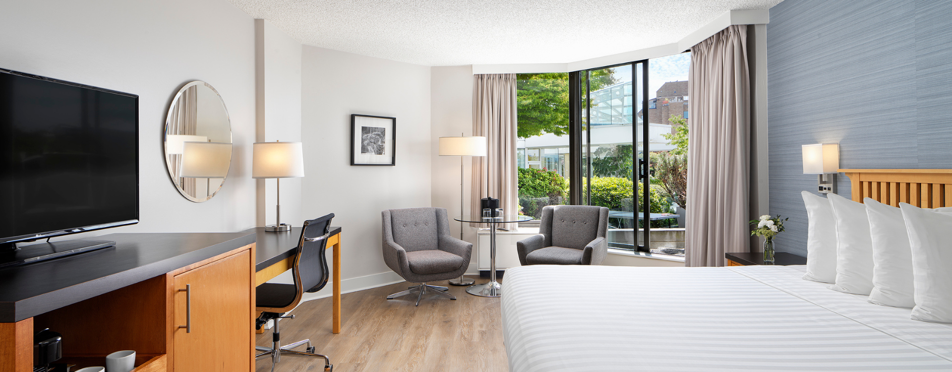 Laurel Wing King Guestroom at Inn at Laurel Point, looking out to private gardens with a ping pong table