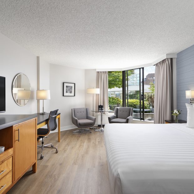 Laurel Wing King Guestroom at Inn at Laurel Point, looking out to private gardens with a ping pong table